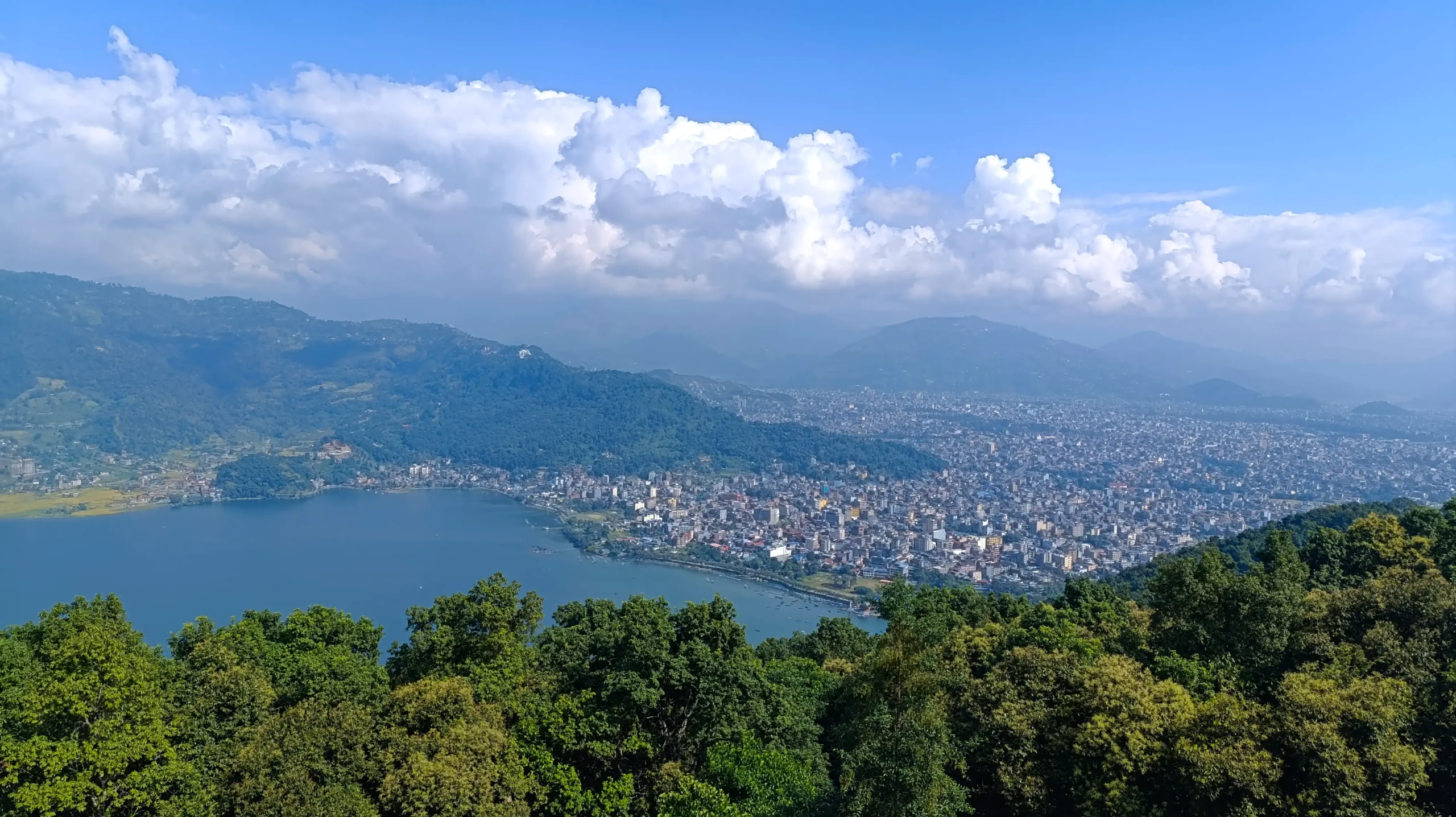 Panoramic view of Pokhara city Fewa Lake and Annapurna mountain range from World Peace Pagoda hilltop Nepal